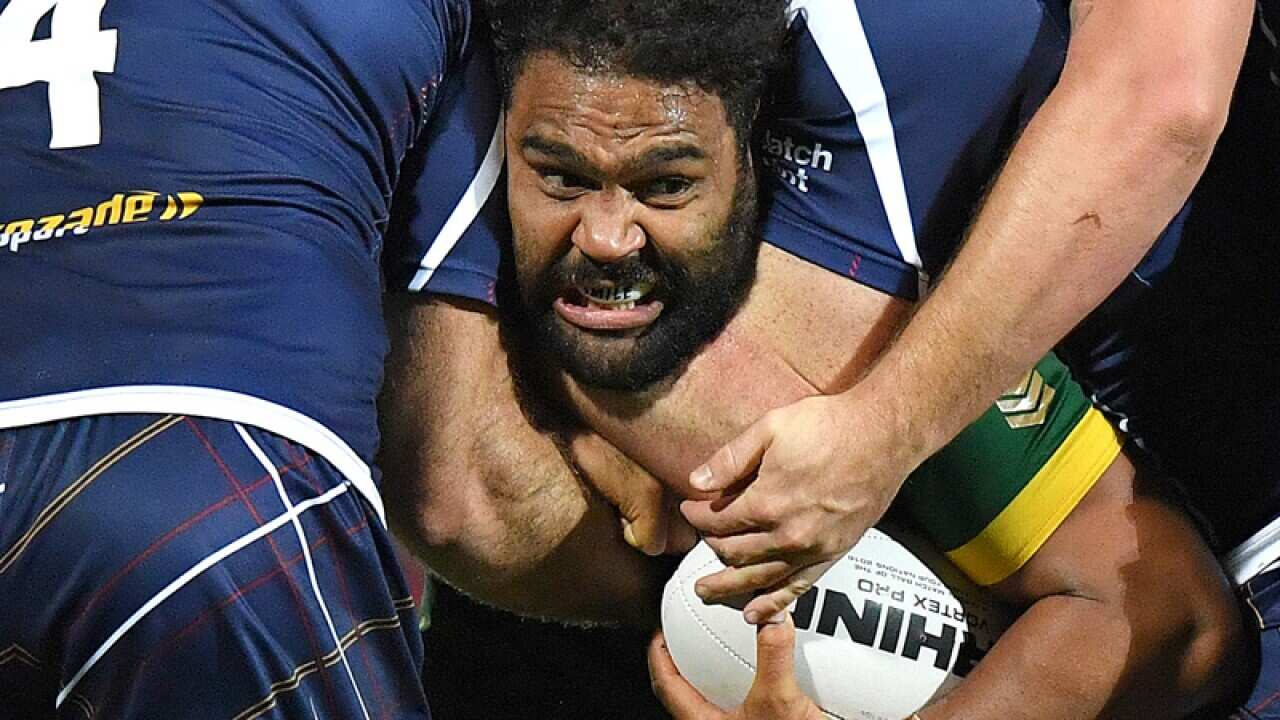 Australia's Sam Thaiday is tackled