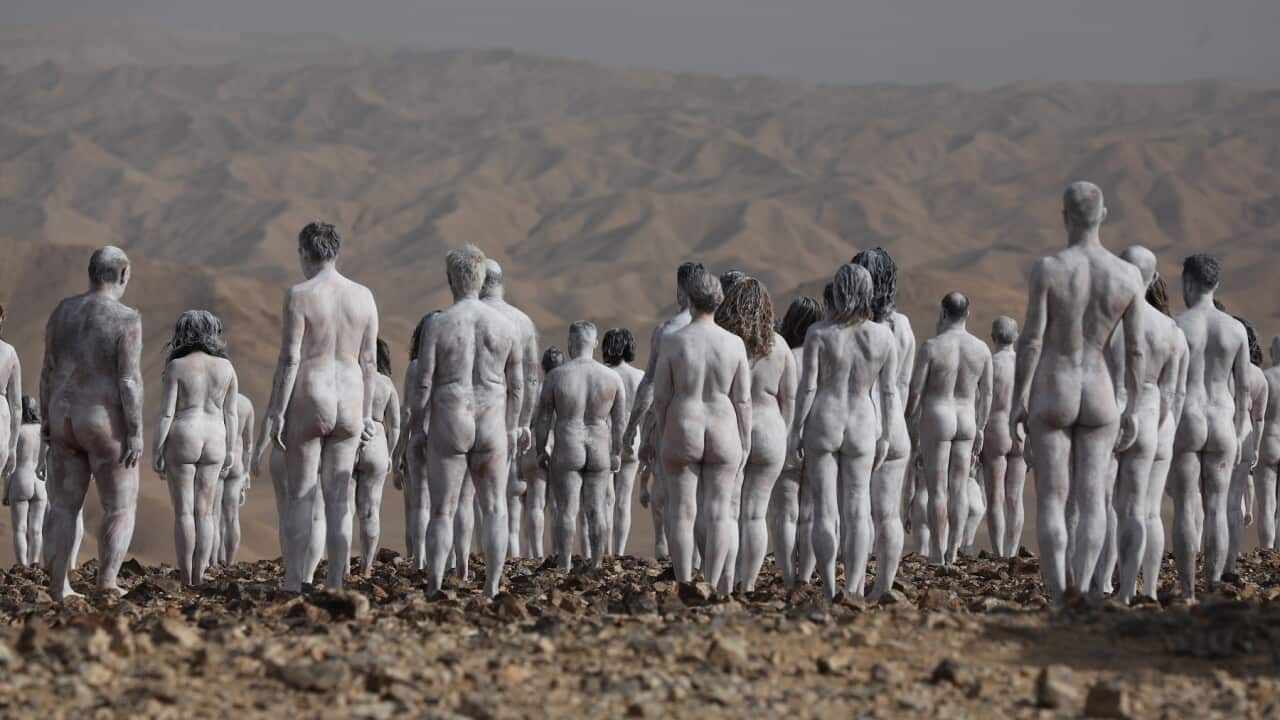 naked people painted white in desert., Spencer Tunick