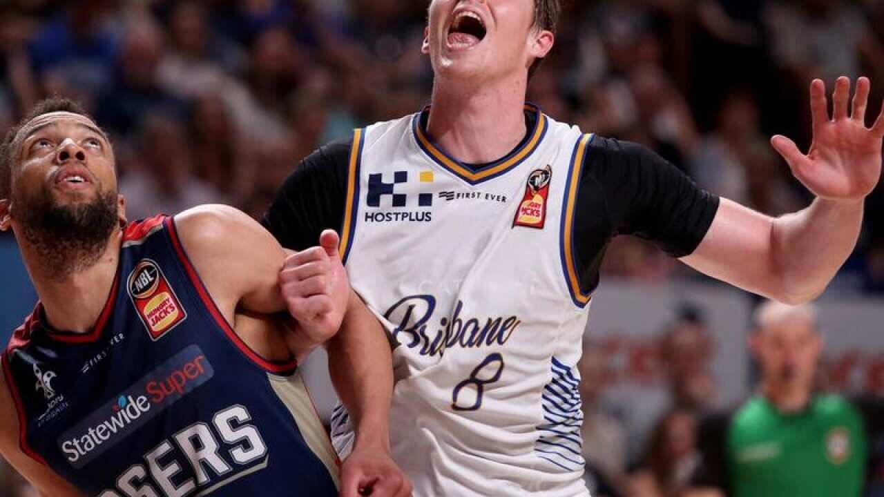 Brisbane Bullets star Cameron Bairstow (R)