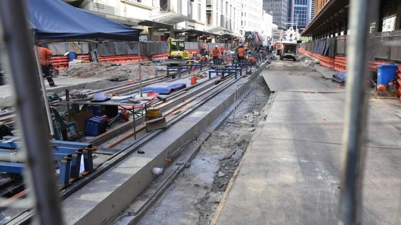 Workers are seen on the George St, Sydney CBD Light Rail Project.