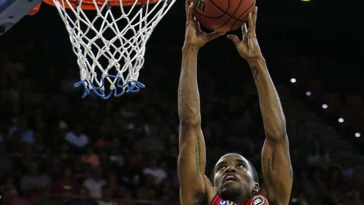 Bryce Cotton of the Wildcats drives to the basket