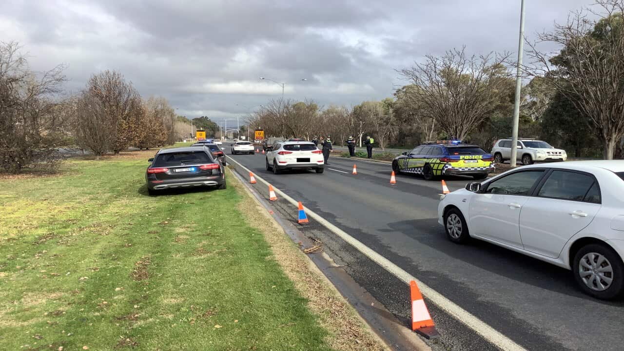 A supplied image obtained on Friday, 25 June, 2021, shows Victoria Police on patrol on the Victoria/NSW border.