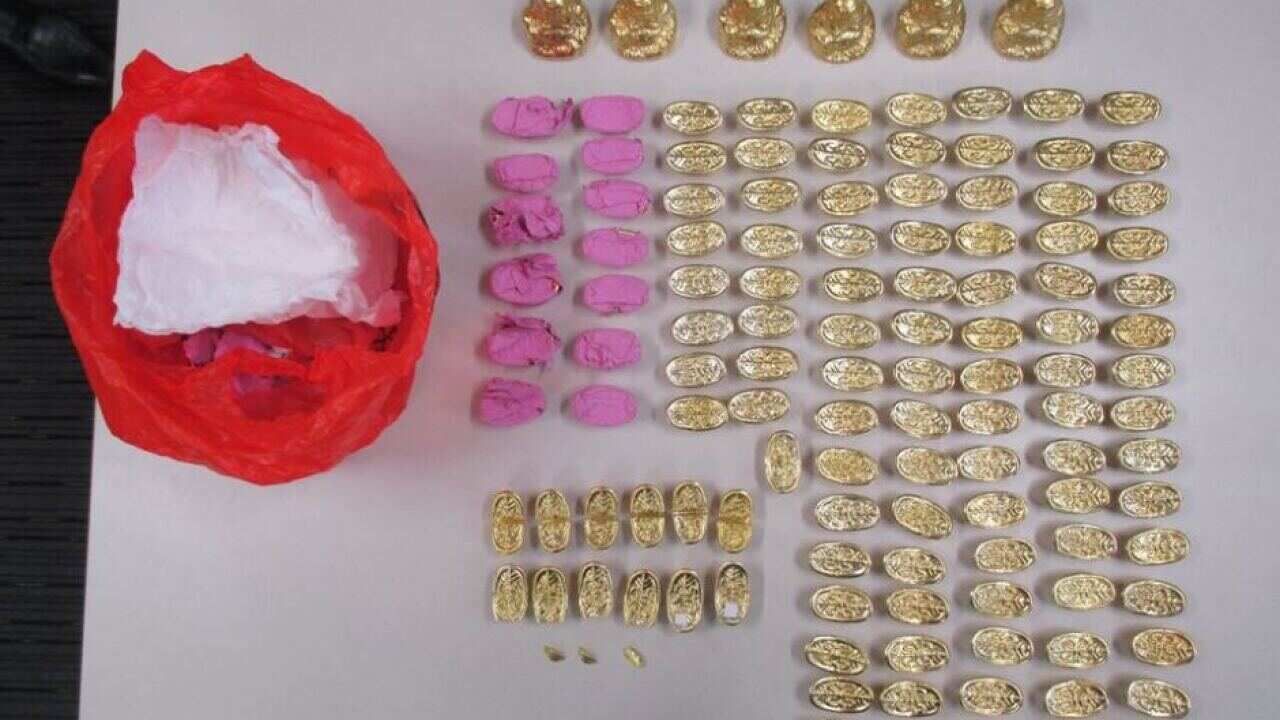 Eight Buddha statues and 100 replica gold ingots were seized by police. (NSW Police)