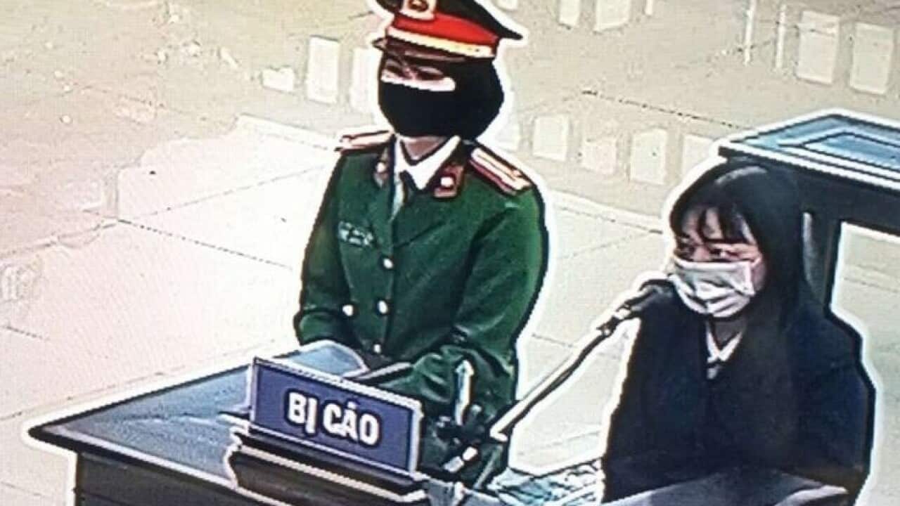 Pham Đoan Trang at Hanoi court on 14/12/2021, photo taken thru screen