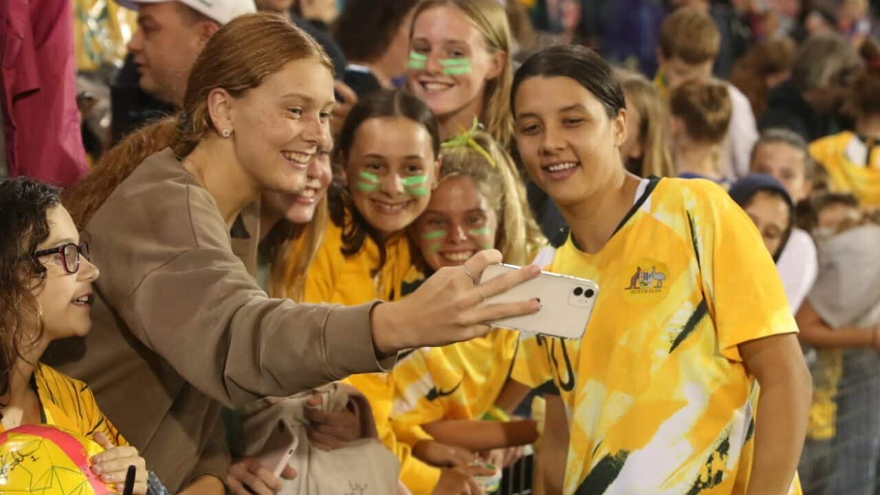 Matildas star Sam Kerr poses for a photo with some fans