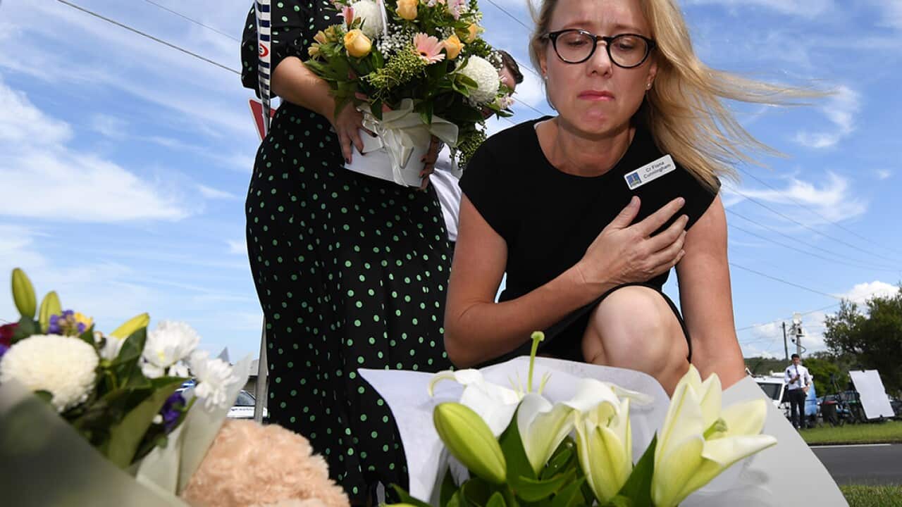 Floral tributes have been left at the scene of a fatal car fire in Brisbane yesterday morning. 