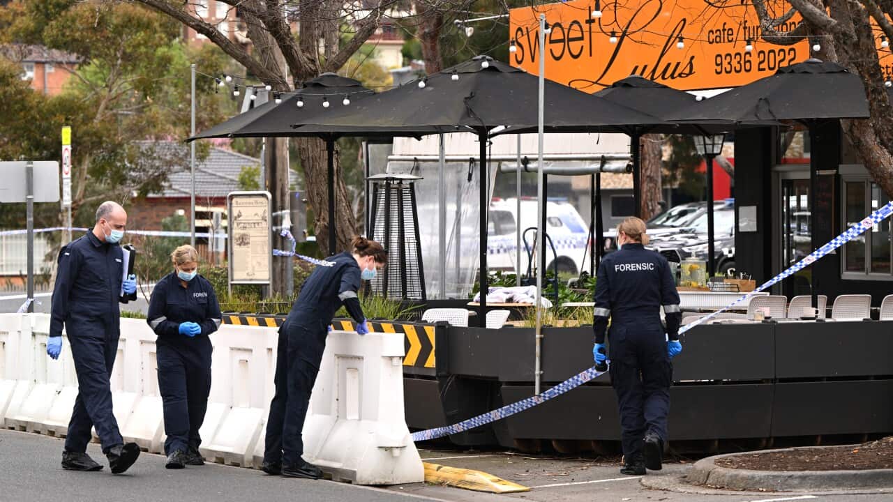 Police work at the scene of a fatal shooting.