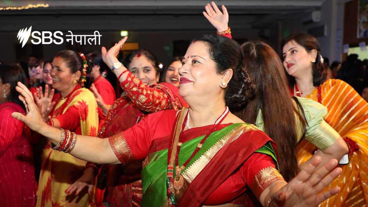 Women dance in the Teej celebration organised by NAV in Melbourne.