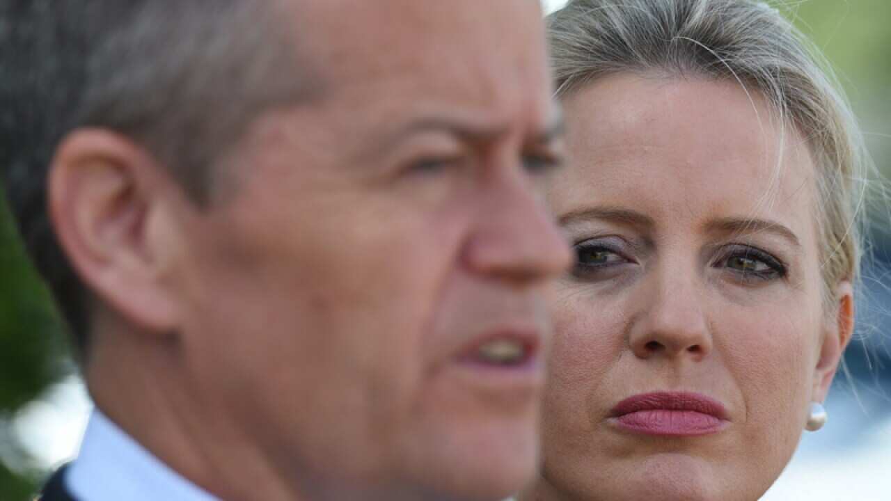 Federal Opposition Leader Bill Shorten, watched by his wife Chloe