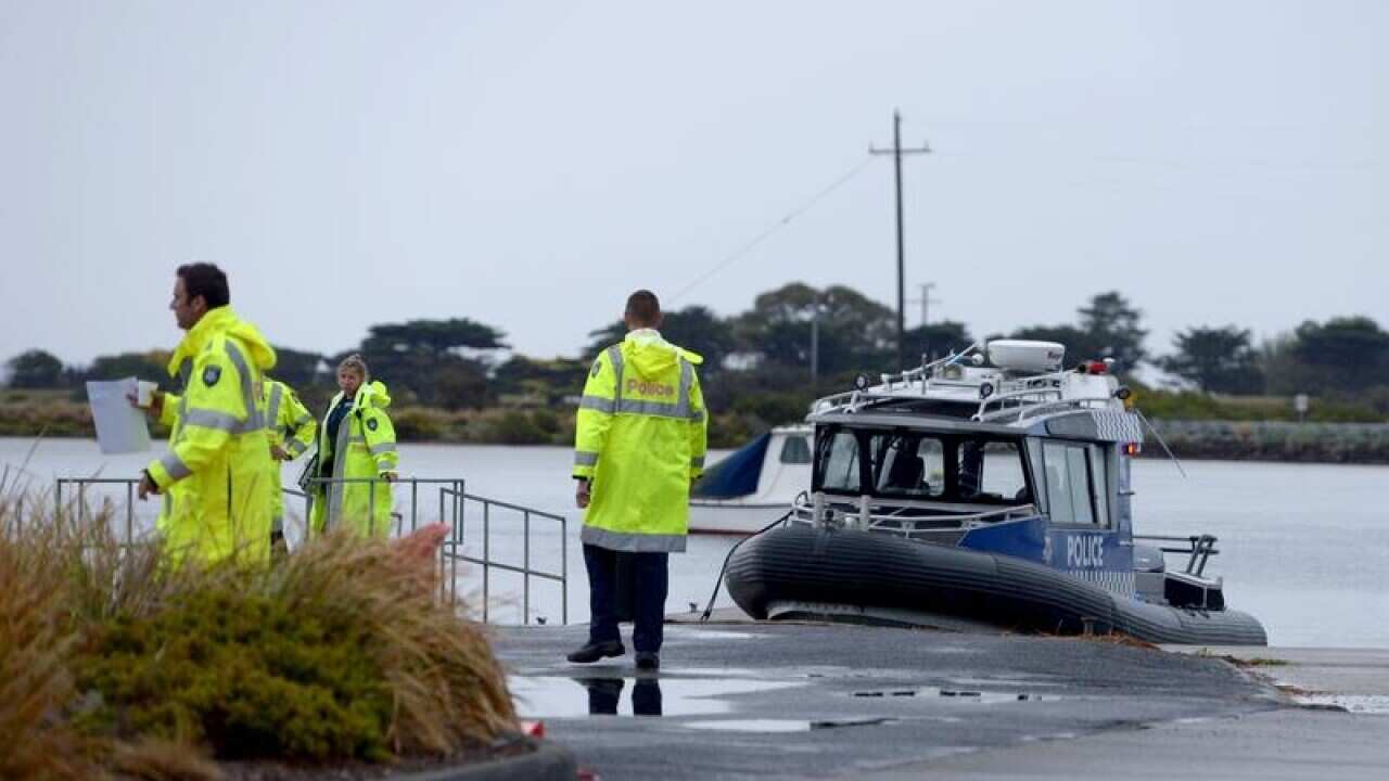 A Victoria Police boat is seen during a search for a light plane