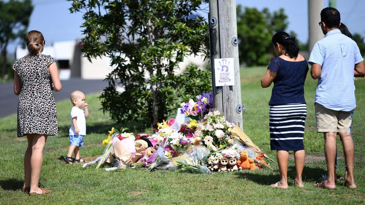 Mourners pay their respects at a makeshift shrine for Hannah Clarke and her kids.