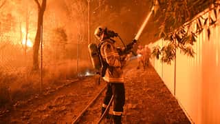 A firefighter sprays water