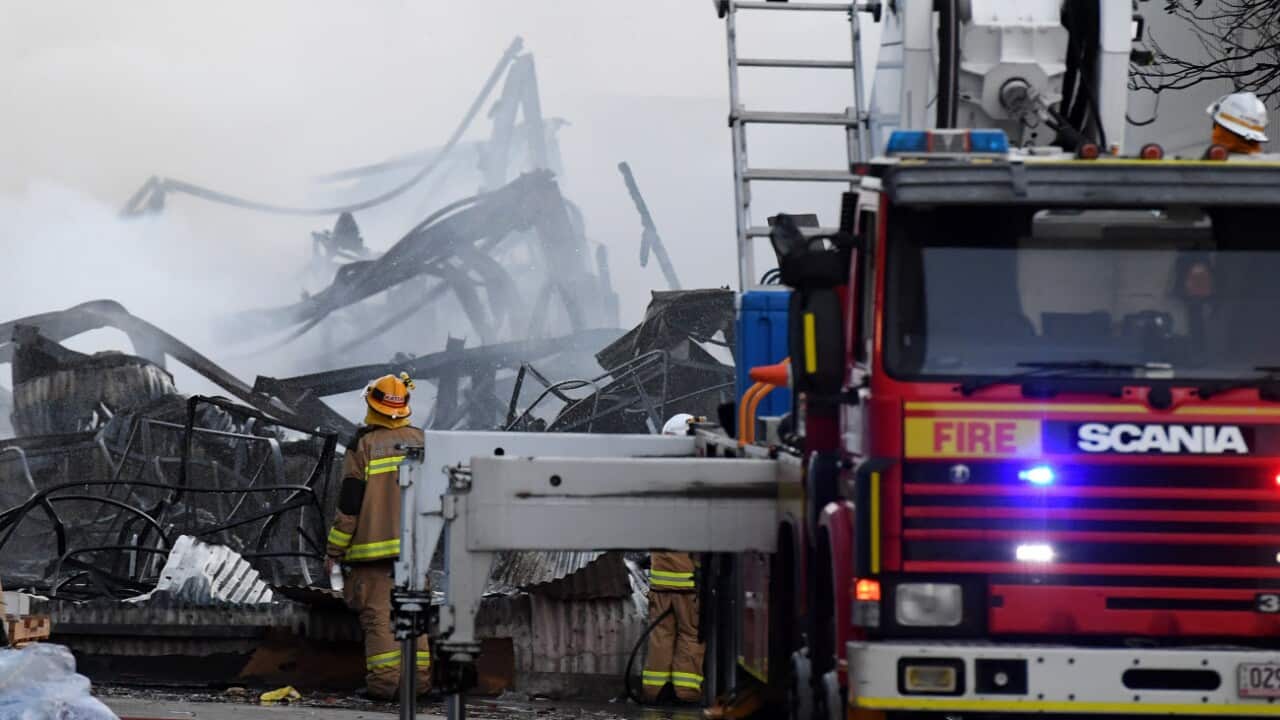 Firefighters put out a large factory fire in Brisbane, Sunday,