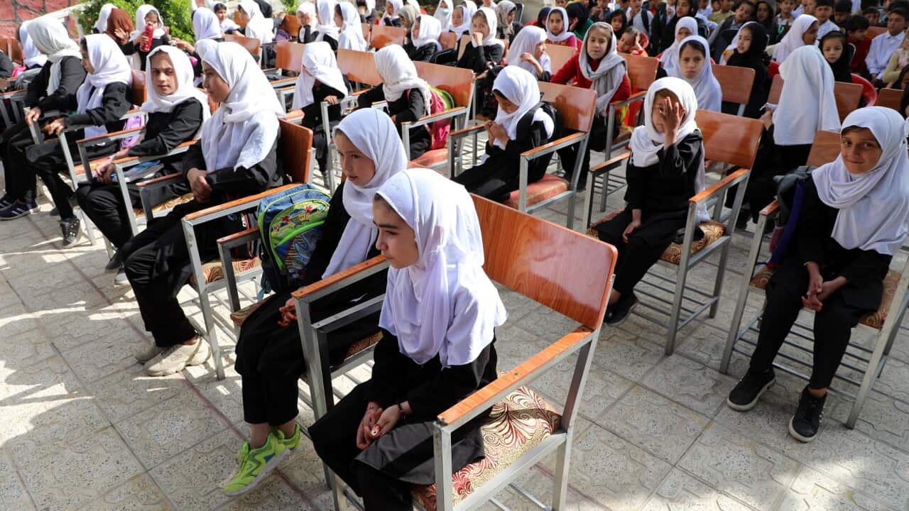 Girl students are seen in the schoolyard in Kabul, Afghanistan on March 22