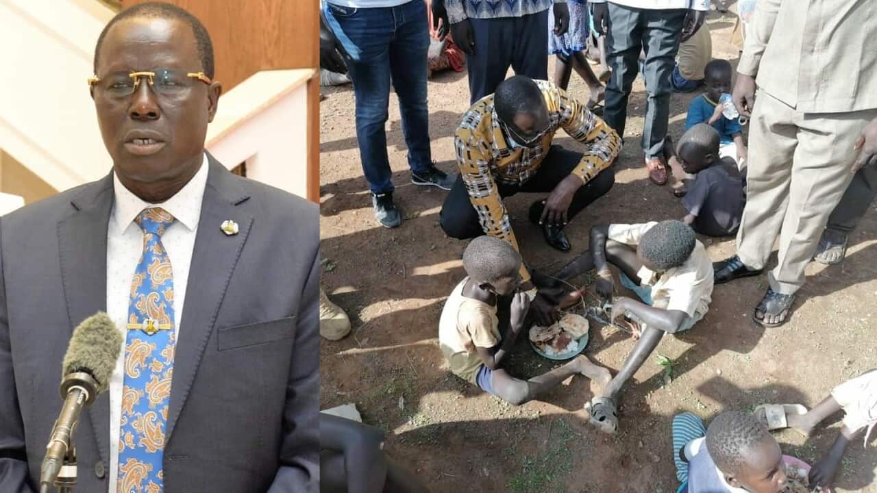 The image of Governor Tong Akeen with homeless children in Aweil.