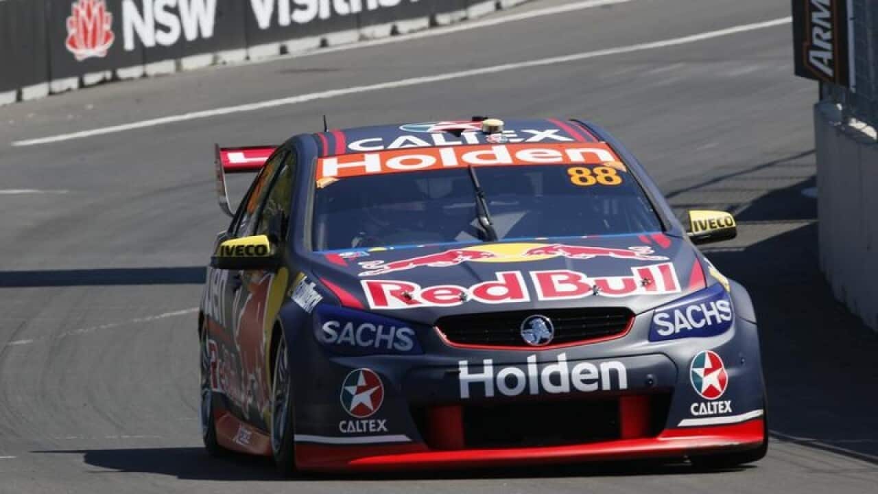 Jamie Whincup drives his Holden Commodore VF during practice session.