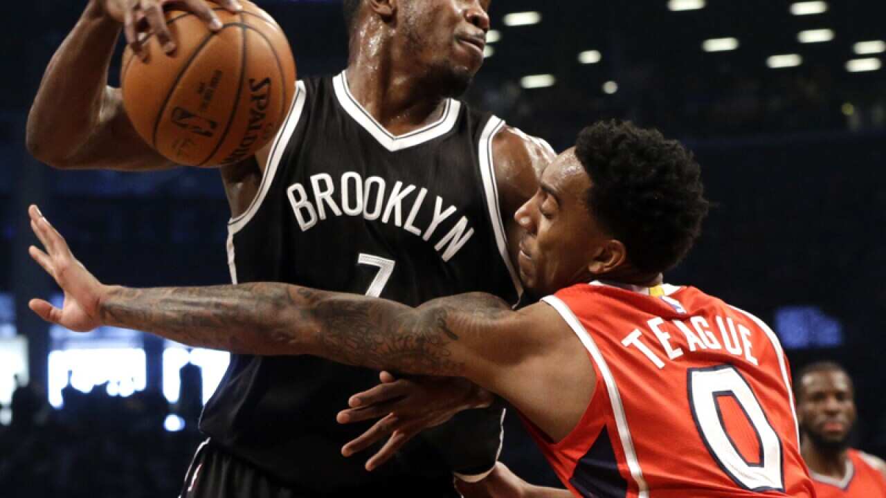 Brooklyn Nets forward Joe Johnson drives to the basket