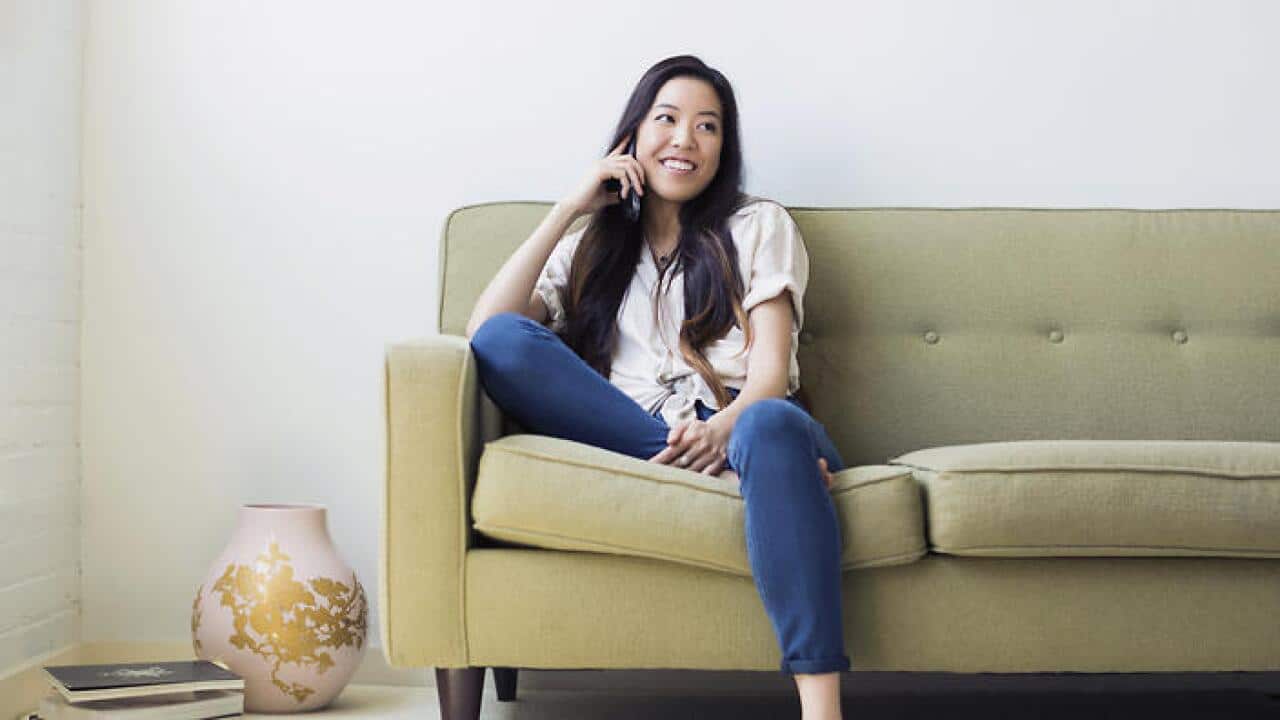 Woman sitting on sofa