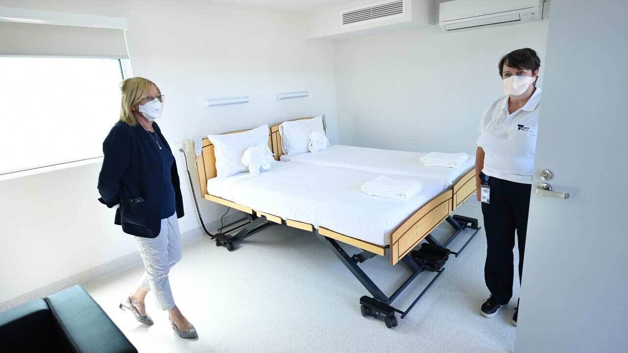 Victorian Police Minister Lisa Neville (left) tours the newly constructed Victorian quarantine accommodation hub in Mickleham, Melbourne, Saturday, February 19, 2022. (AAP Image/James Ross) NO ARCHIVING