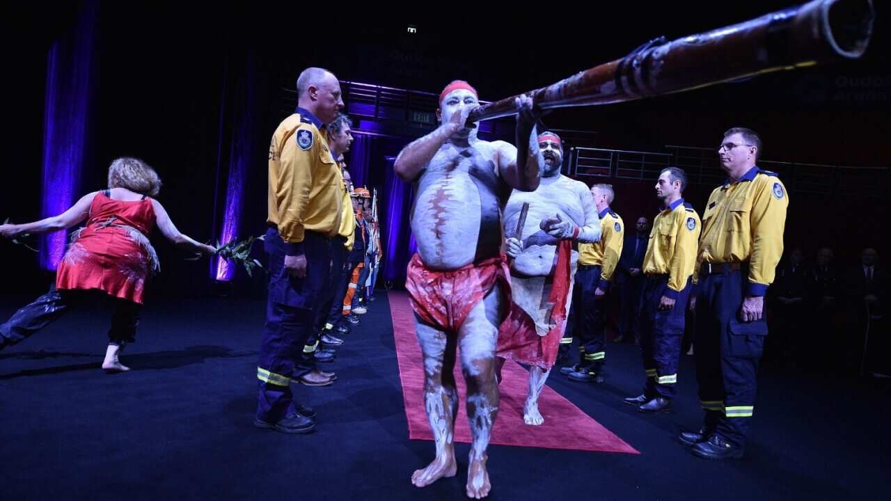 Aboriginal dancers perform during a Bushfire State Memorial at Qudos Bank Arena in Sydney, Sunday, February 23, 2020.