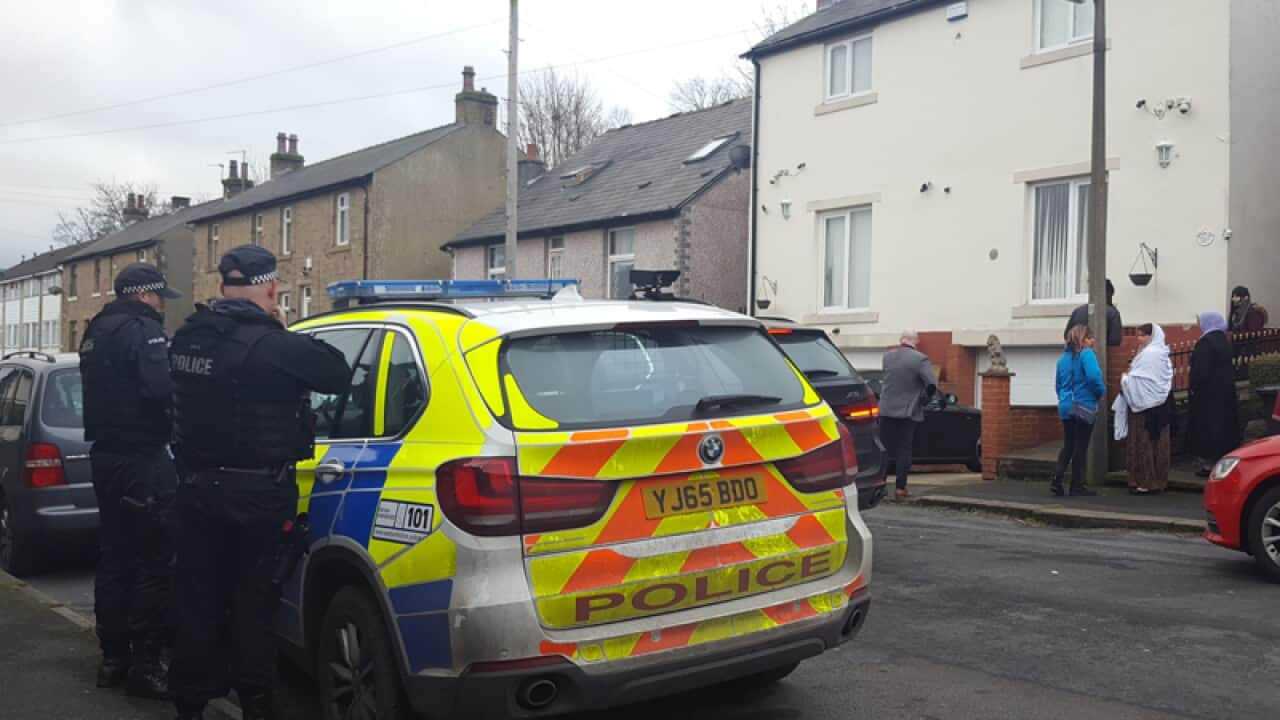 Police at the home of the reported victim