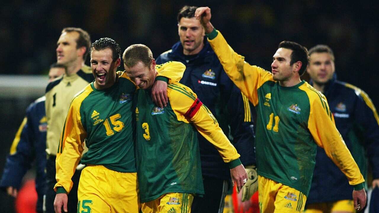 The Socceroos celebrate their victory over England in 2003