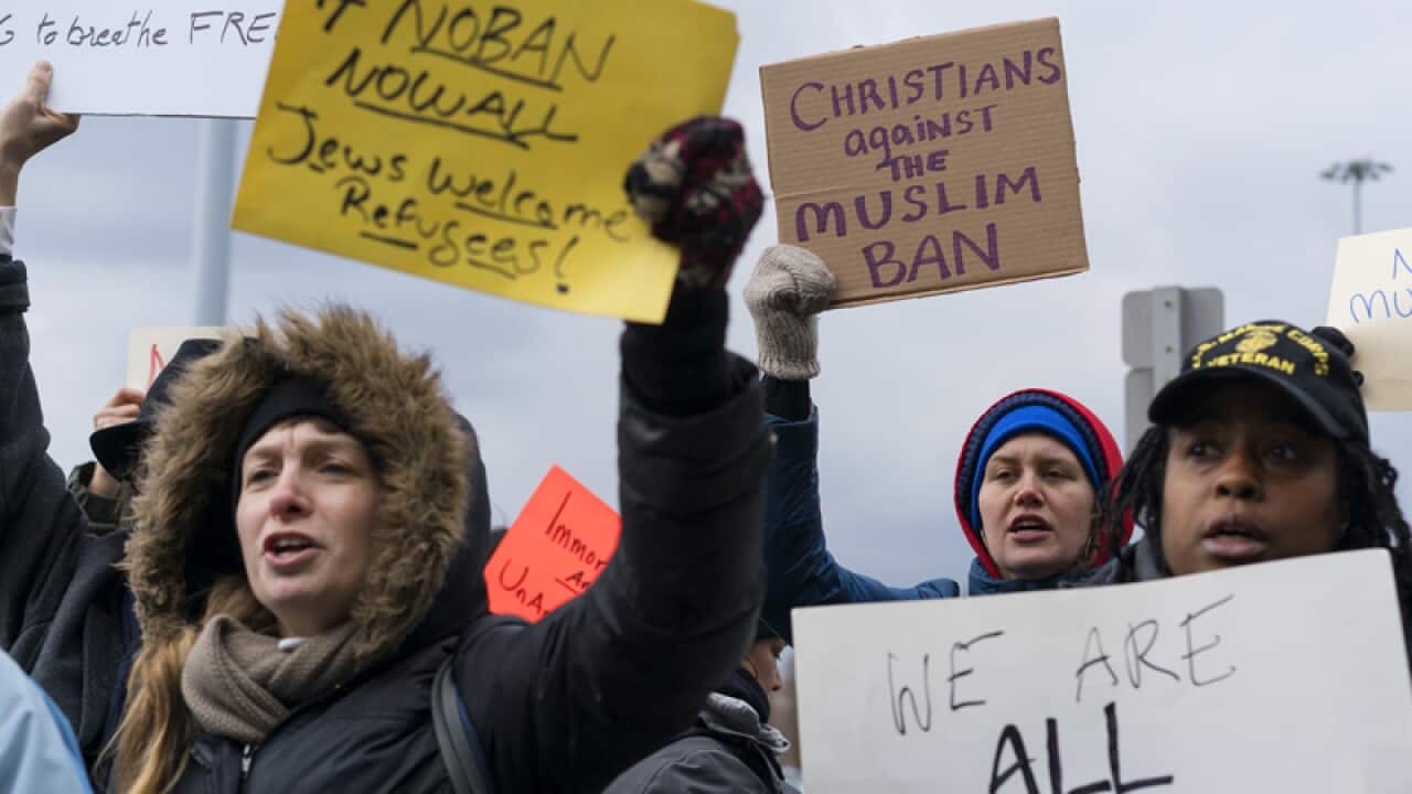 Protesters assemble at John F. Kennedy International Airport