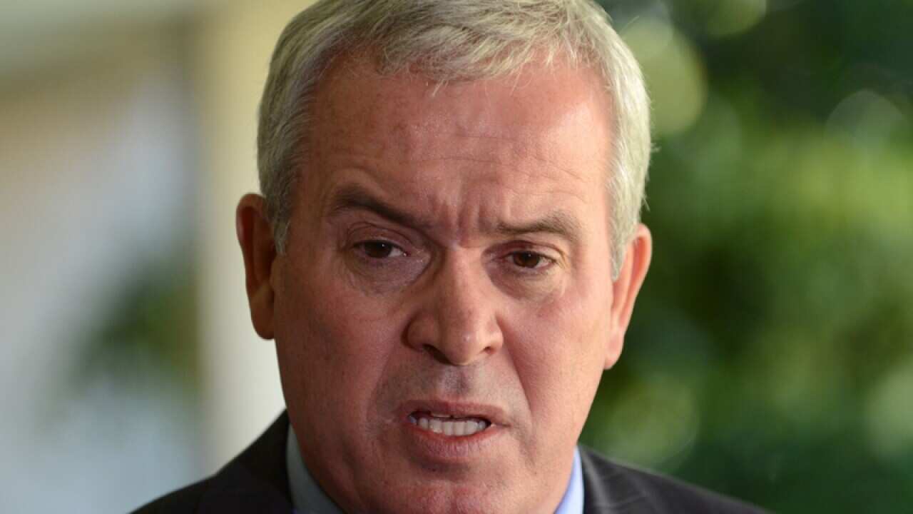 Alex Douglas at a presser.