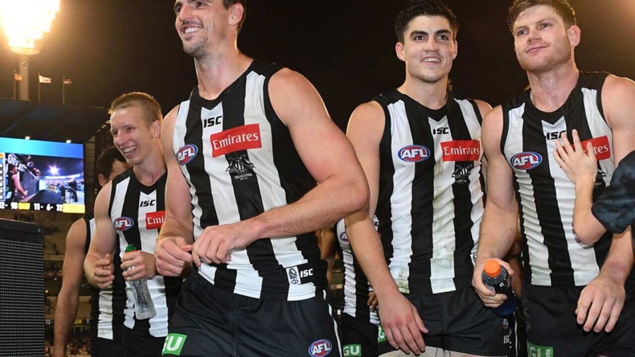 Scott Pendlebury of the Magpies leads his team from the ground