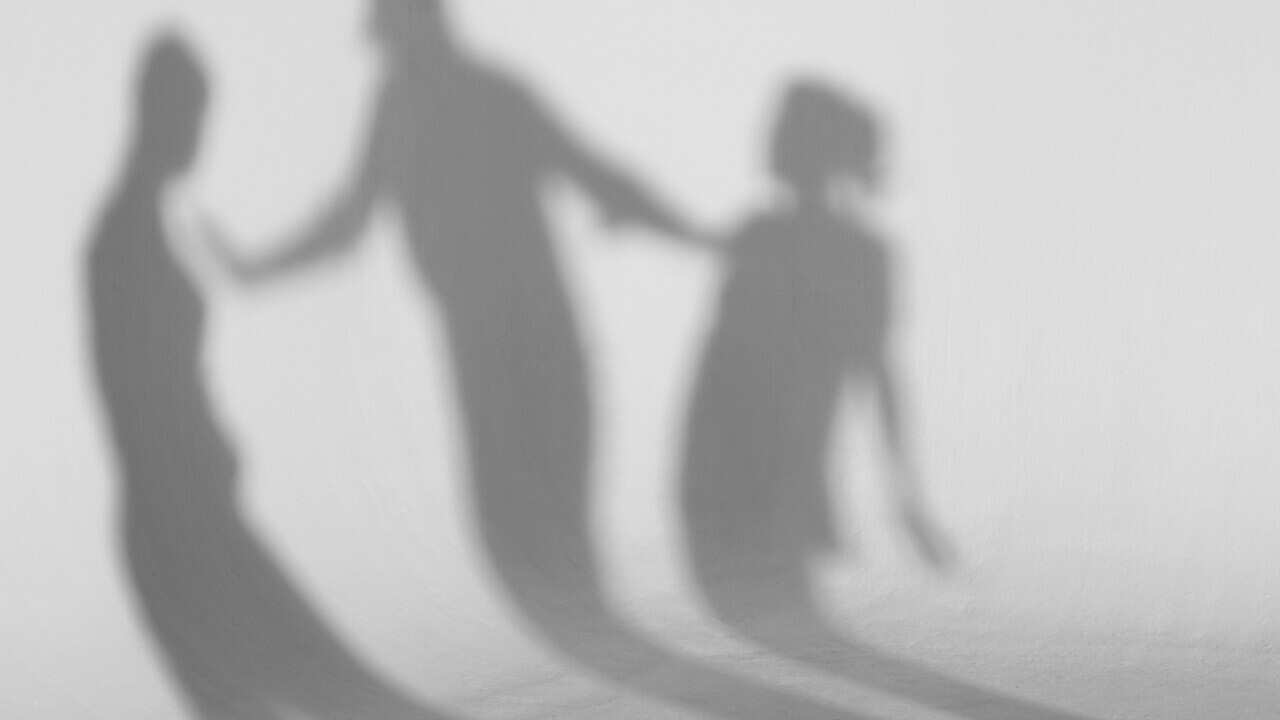 Shadows standing in front of white background