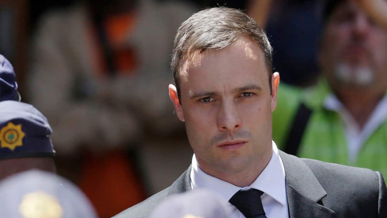 File photo from Oct 2014 of Oscar Pistorius leaving the high court in Pretoria, South Africa.