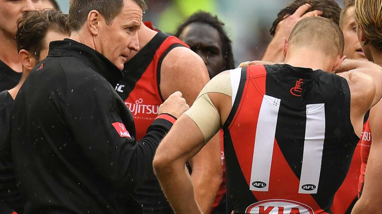 Coach of the bombers John Worsfold (L)