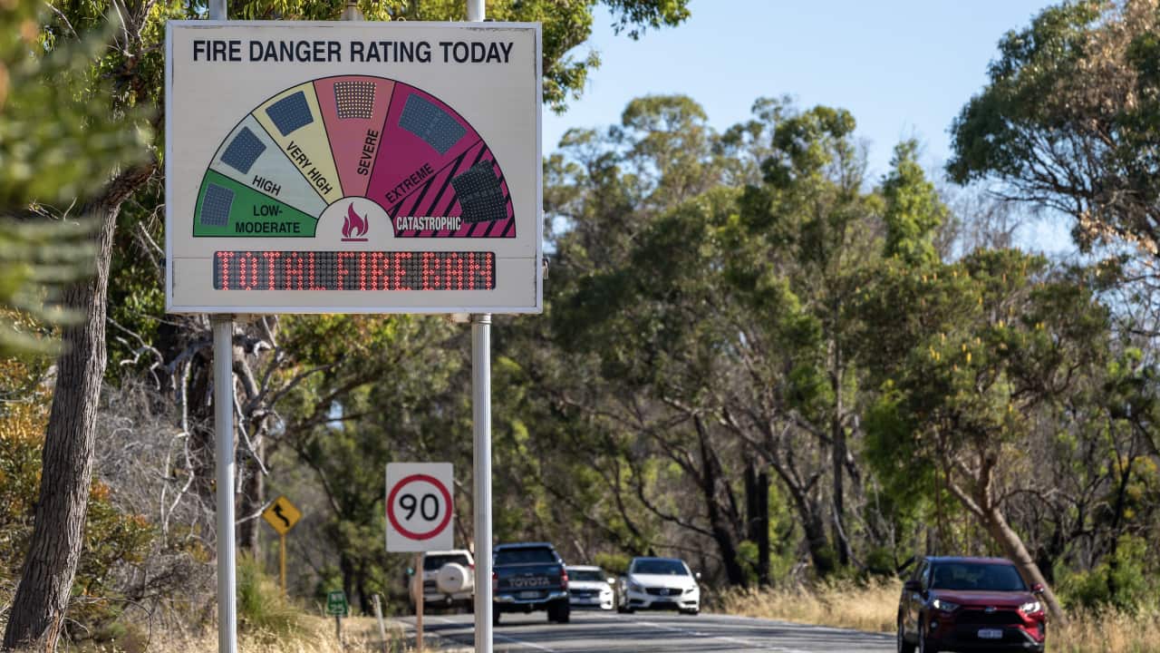 A roadside Fire Danger Rating sign indicating Severe conditions and a Total Fire Ban is seen about 50km north of Perth on Friday.