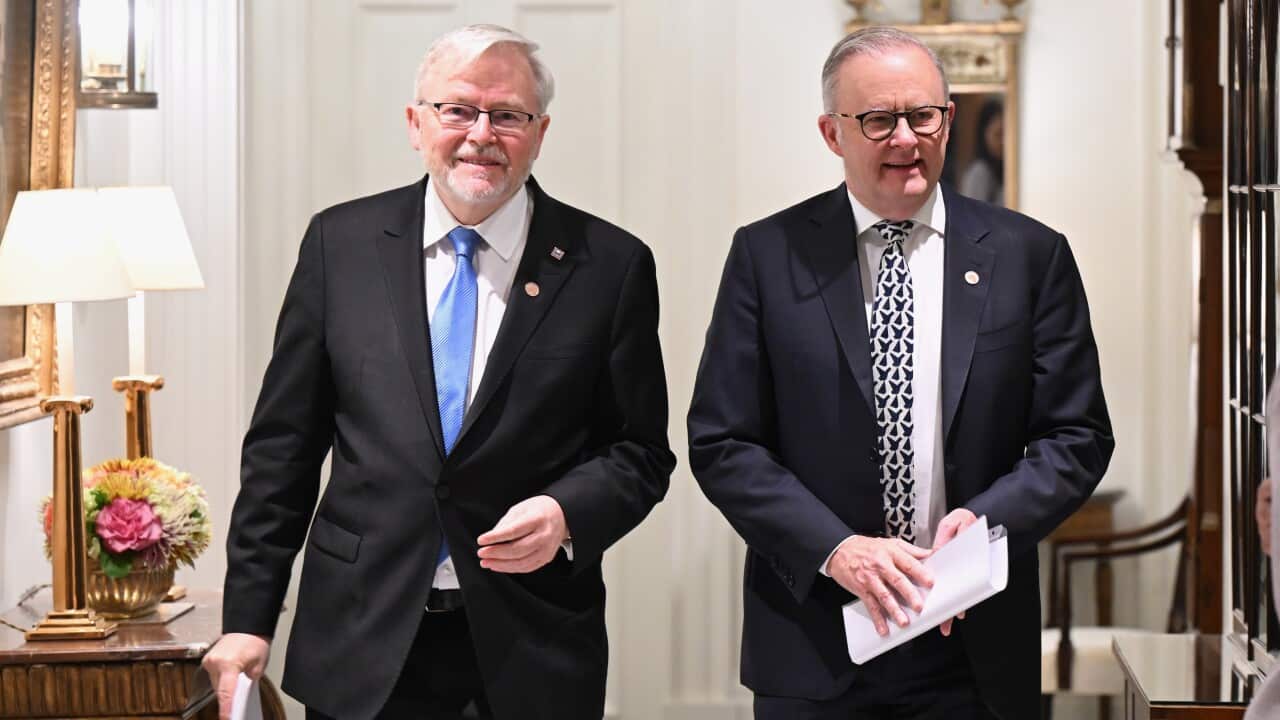 Two men wearing suits and ties