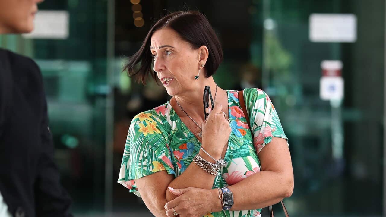 Sue Clarke leaves Brisbane Coroners Court for the inquest into the death of her daughter, Hannah