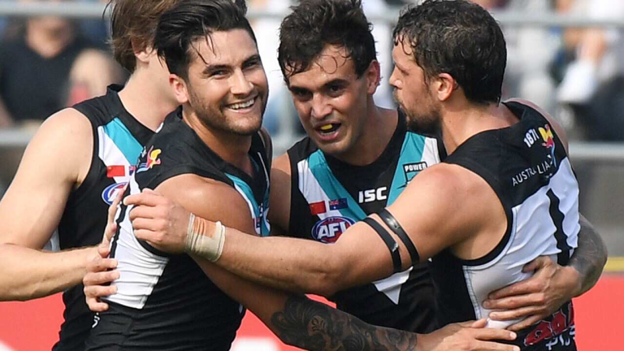 Brendon Ah Chee of the Power (C) celebrates a goal