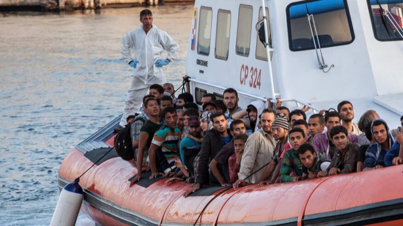 rescued_migrants_being_brought_onshore_to_palermo_aap_larger.jpg