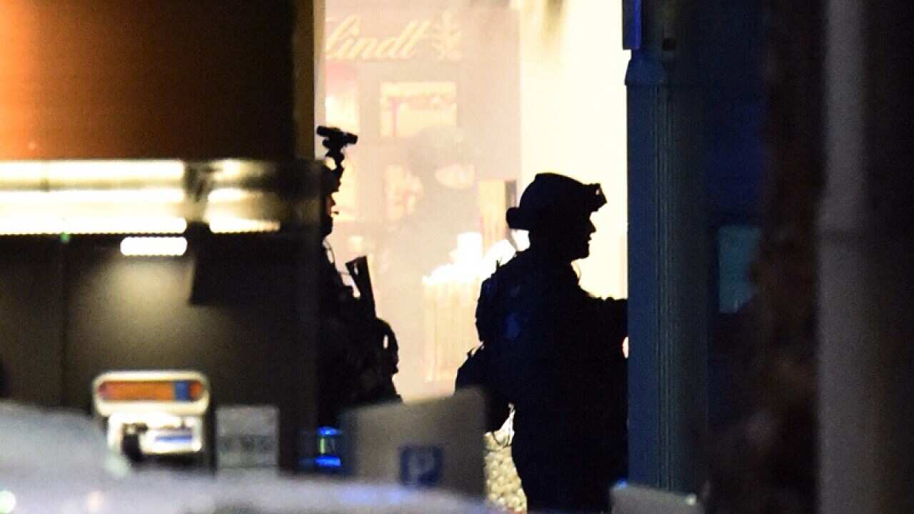 Police storm the Lindt cafe in Martin Place