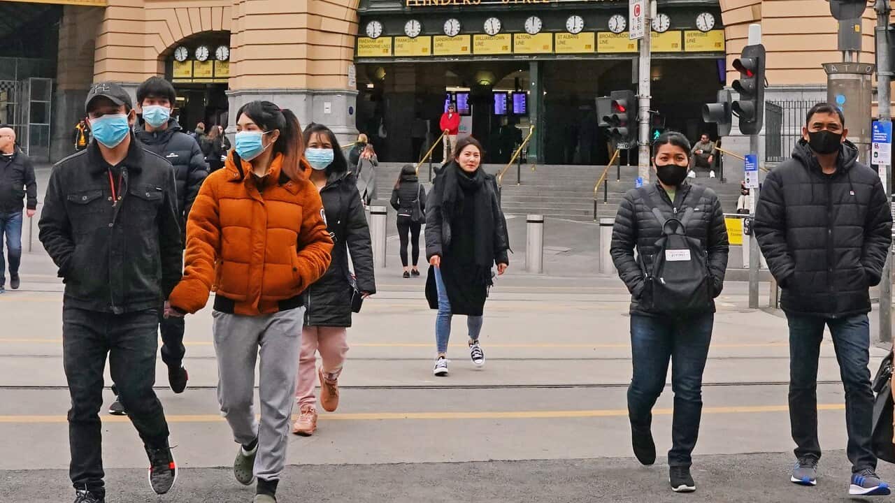 People leave Flinders Street Station in Melbourne, Sunday, 21 June, 2020. 