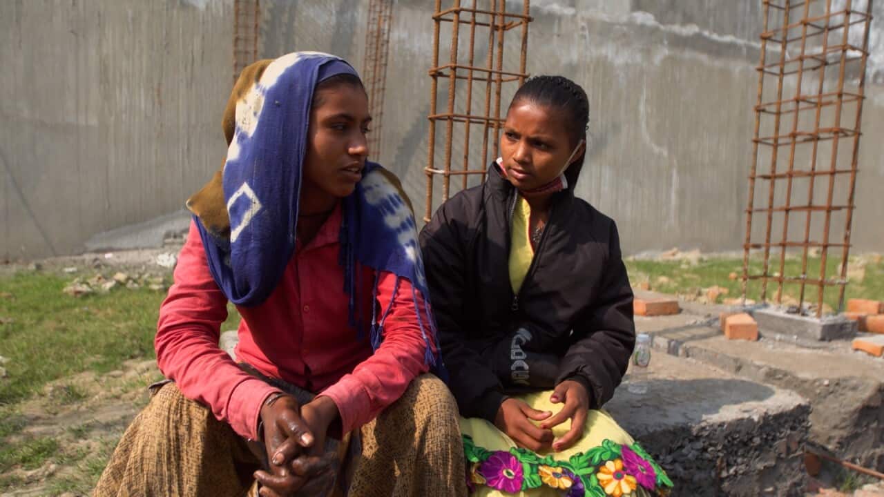 Two street kids in Balaknama sitting in a construction site.