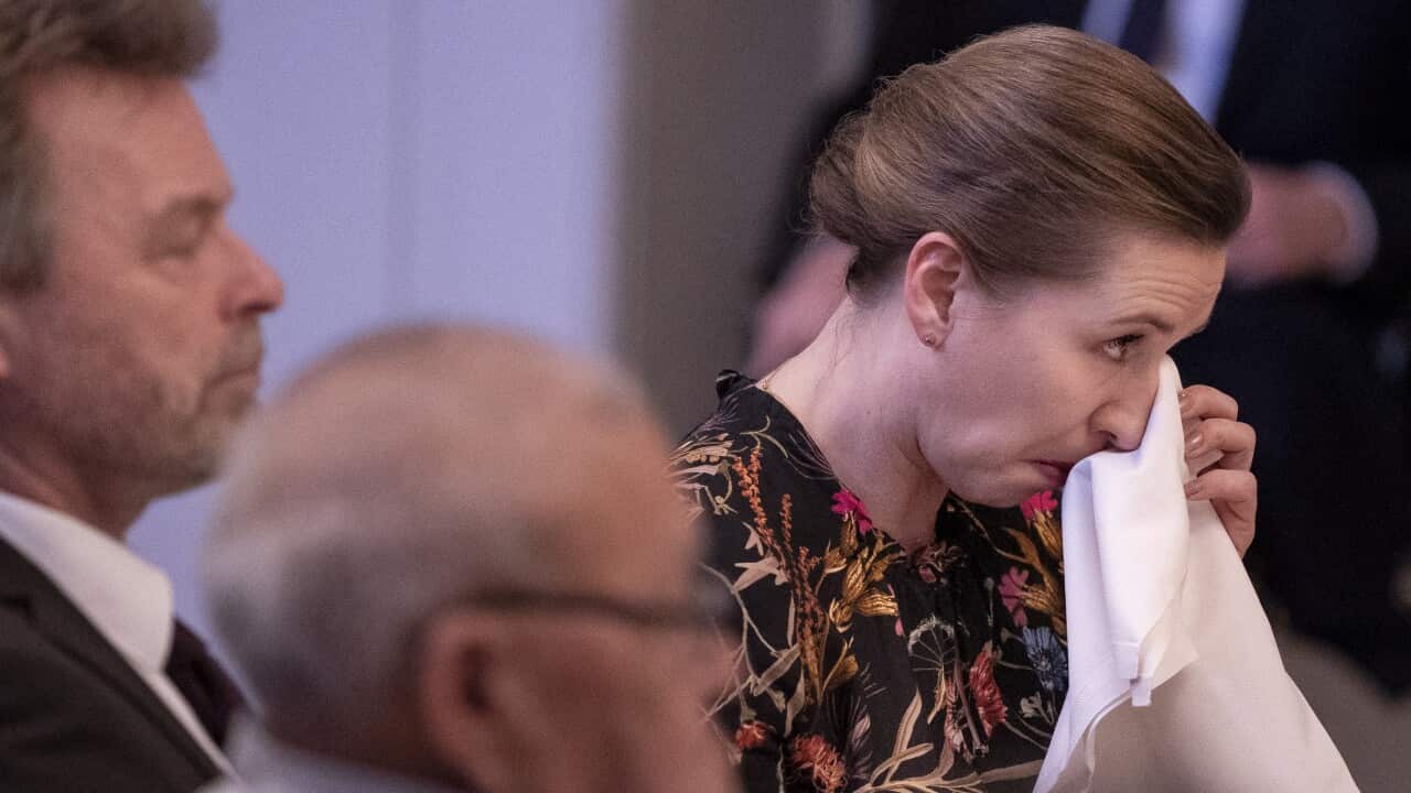 Danish prime minister Mette Frederiksen reacts during an event where she apologized personally to six Greenlandic Inuit