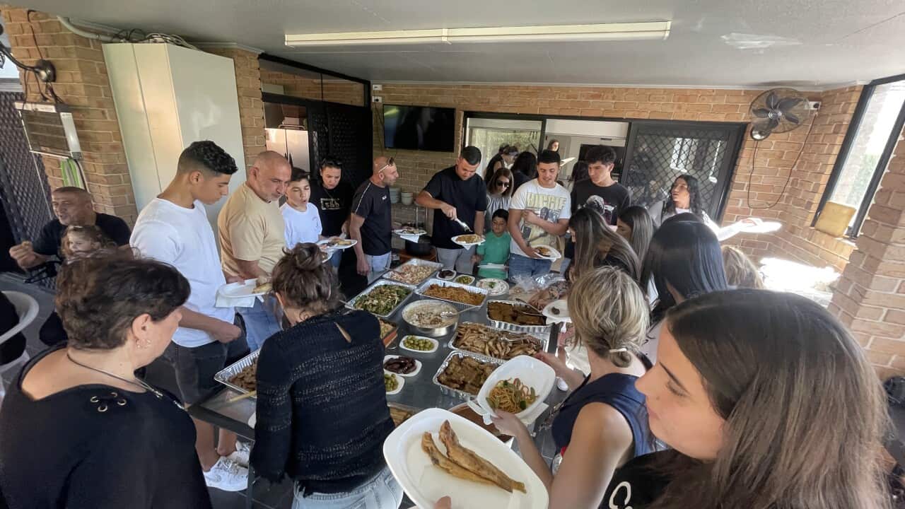 Ramona Mourad's family enjoy a traditional Good Friday meal of monk's soup and other dishes.