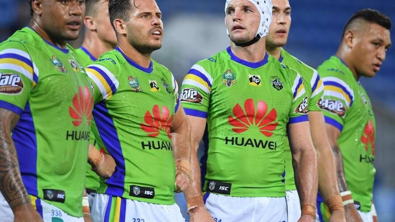 Raiders players look on following a try from the Gold Coast Titans