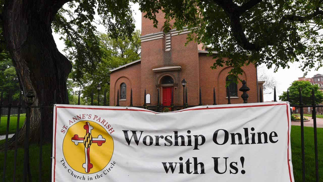 A sign hangs on the fence of St. Anne's Episcopal Church in Annapolis, Maryland.