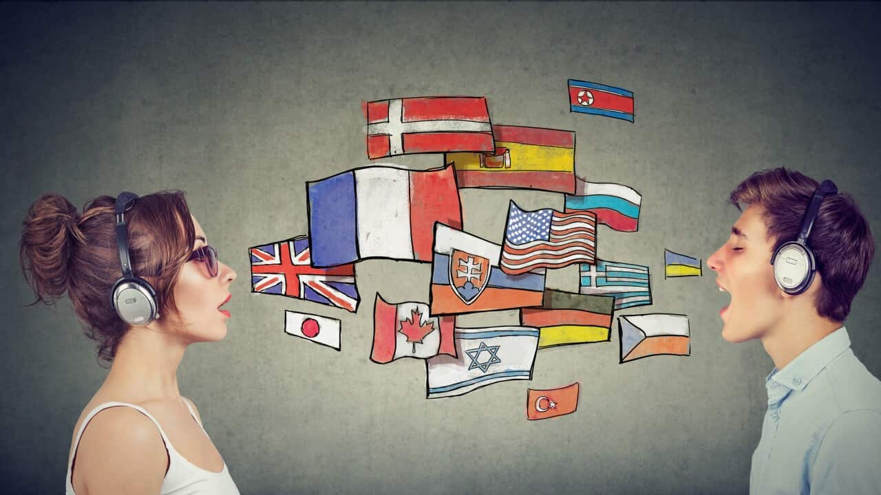 Young woman and man in headphones learning different languages communicating