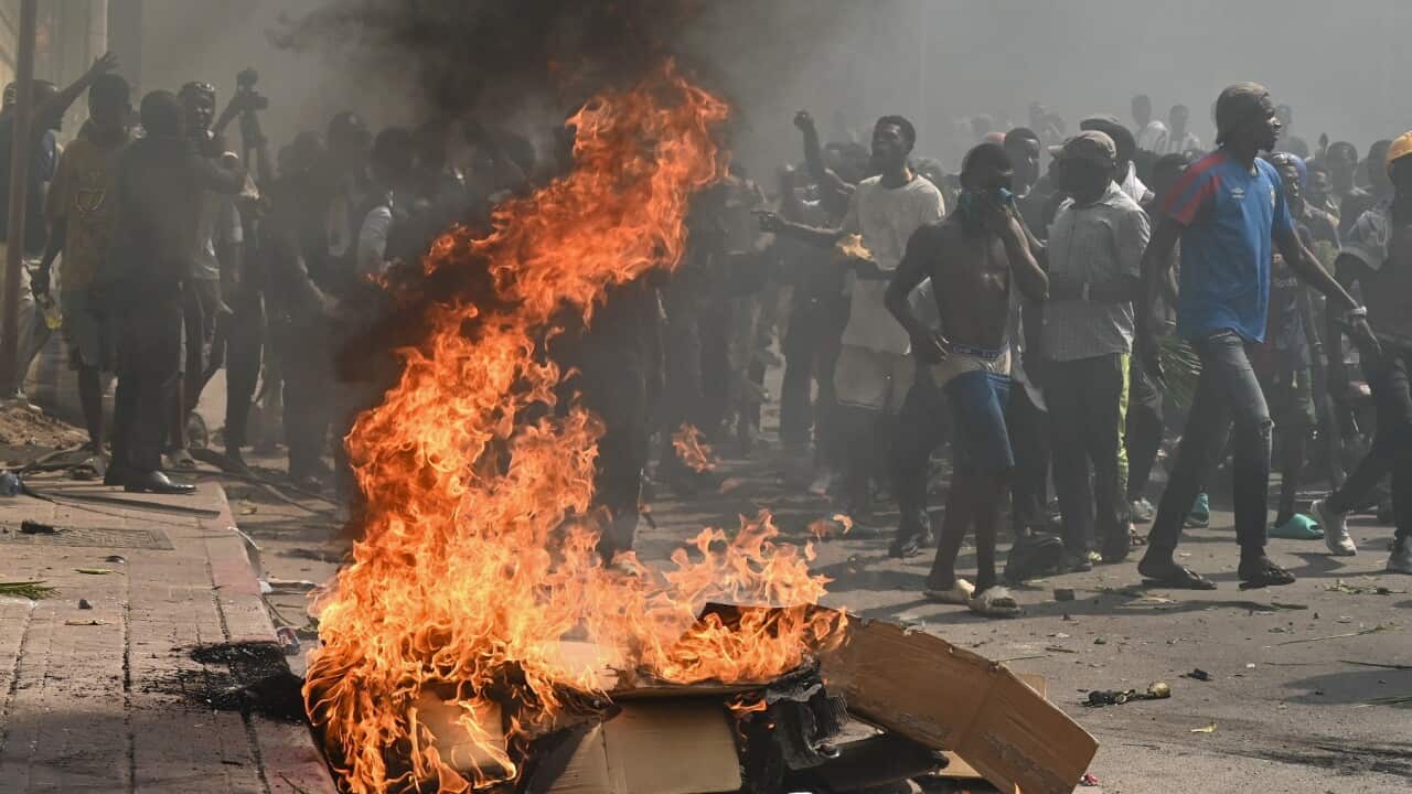 Protesters march against the escalating conflict in eastern DRC in Kinshasa