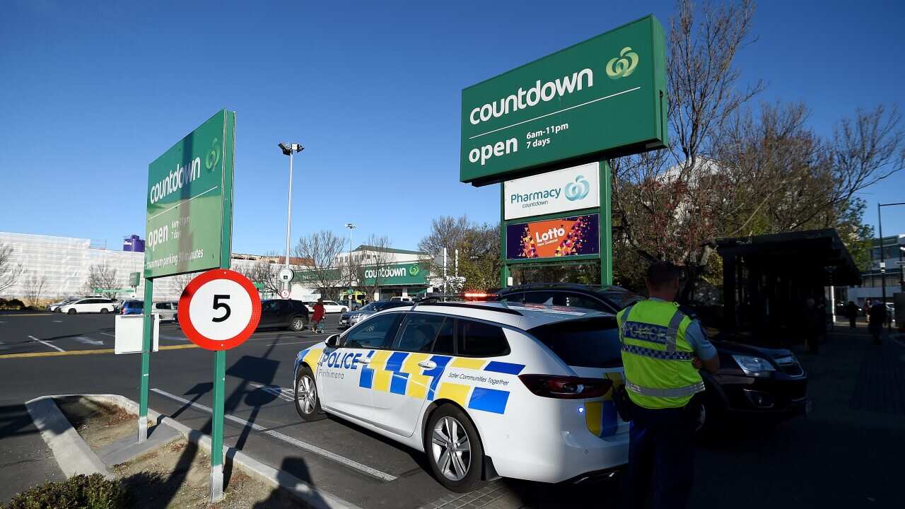 A police officer is observed cordoning off the Dunedin Central Countdown carpark on 10 May, 2021 in Dunedin, New Zealand.