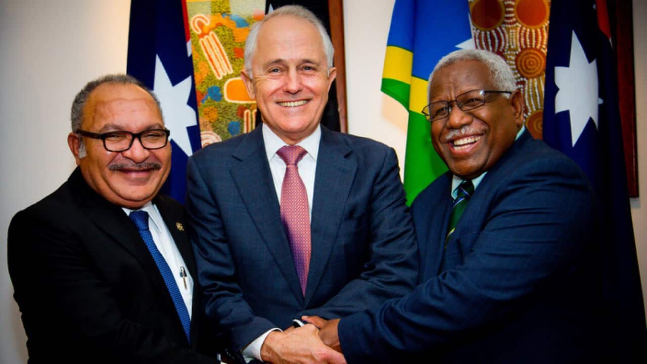 Malcolm Turnbull poses for a photo with Papua New Guinea Prime Minister Peter ONeill and Solomon Islands Prime Minister Rick Houenipwela.