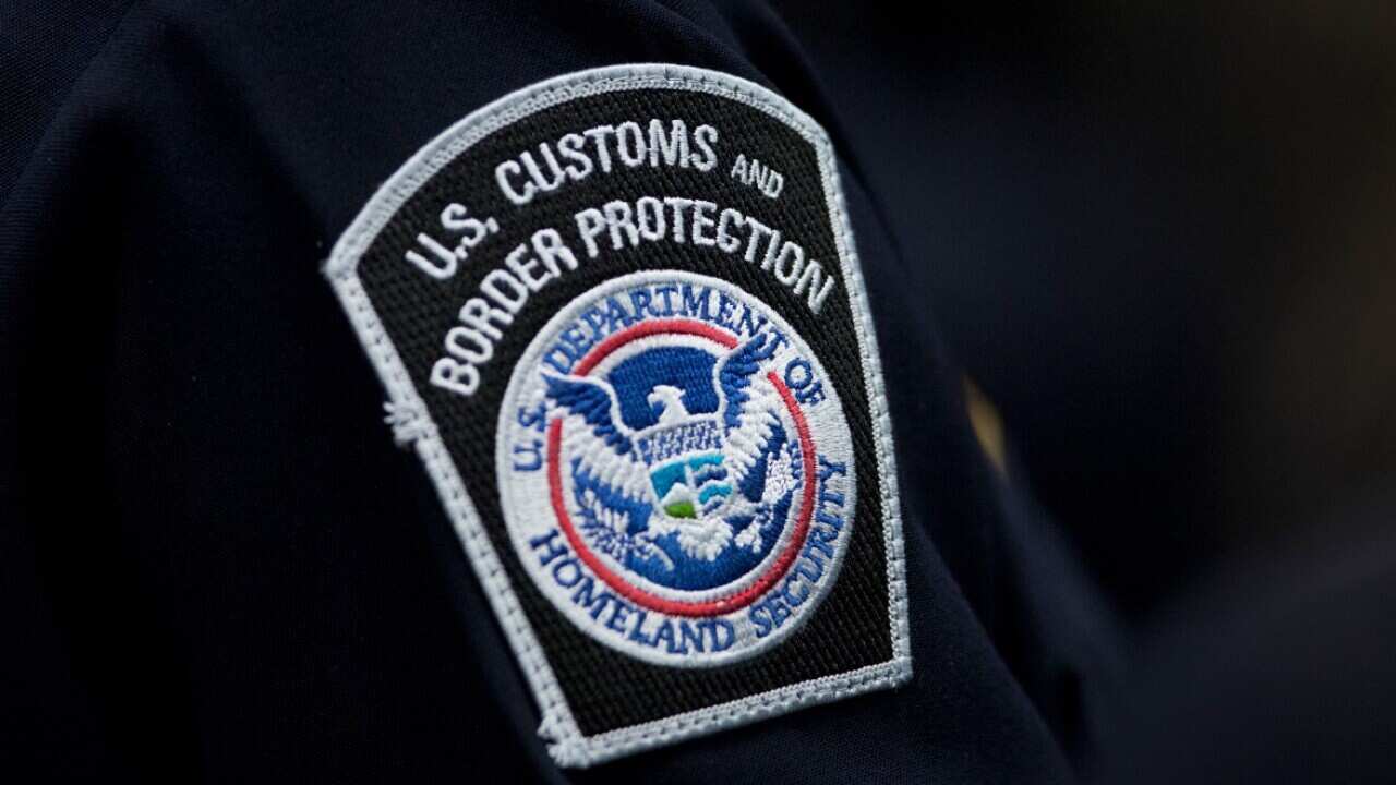 A customs agent wears a patch for the U.S. Customs and Border Protection agency