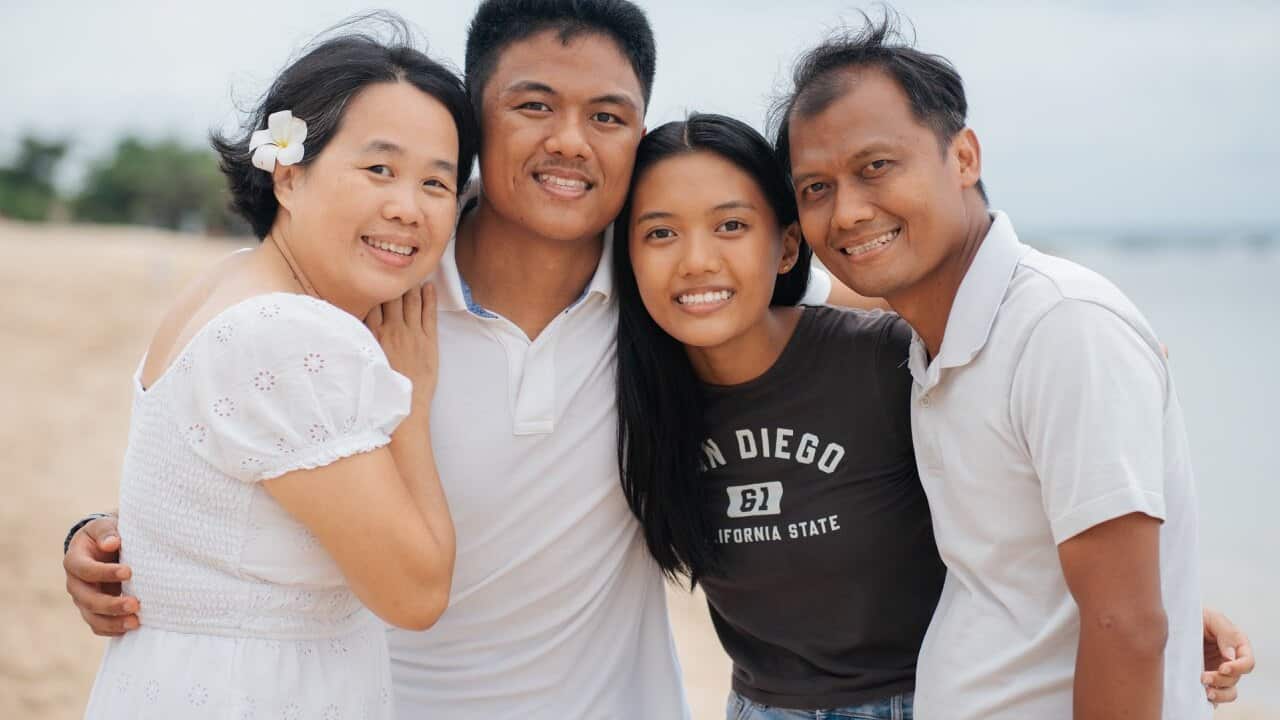Lenny and her husband Henry with their children Peter and Eva Susanto (centre).Credit_ Supplied_Lenny.jpg